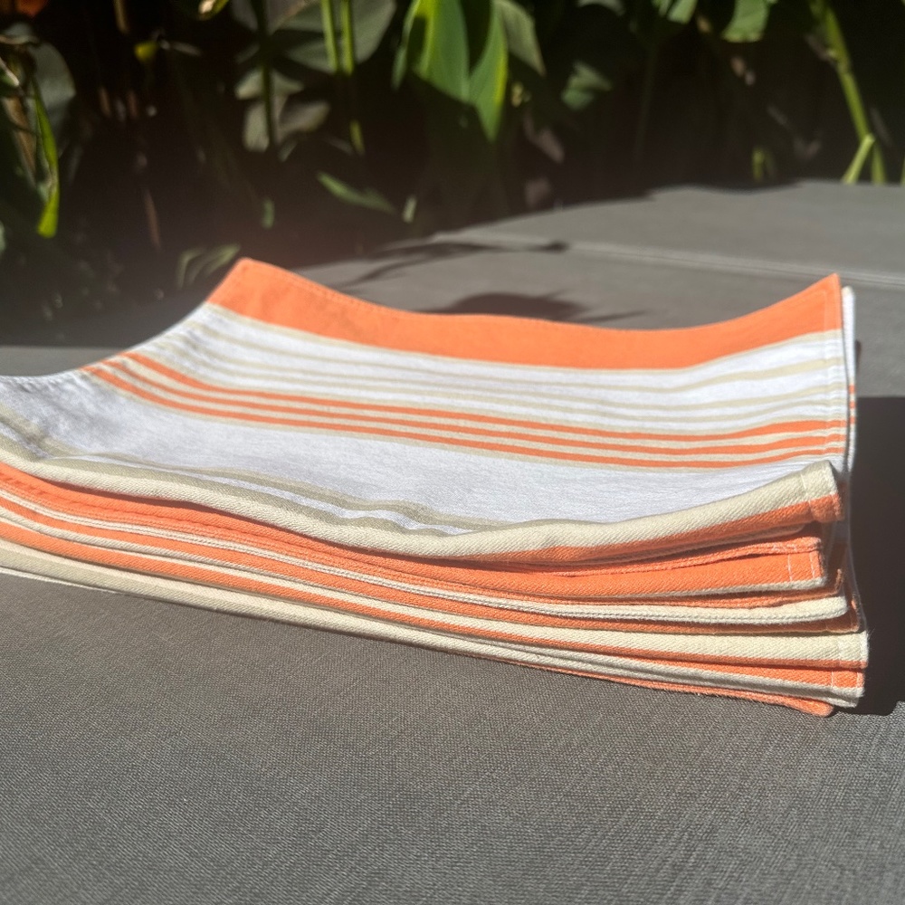 Pottery Barn orange, tan and white striped placemats, nine!